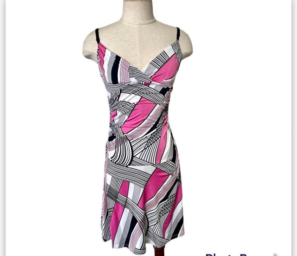 Have pink black and white sleeveless dress